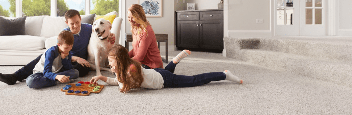 pet friendly carpet shown with family and dog in living room