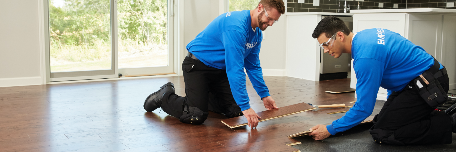 two Empire flooring installers installing Empire flooring