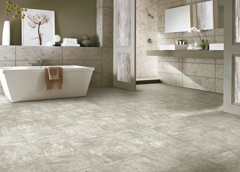 Vinyl tile is moisture and slip resistant, and can also be installed without grout, making it easier to clean