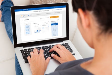 woman using laptop to get new floors