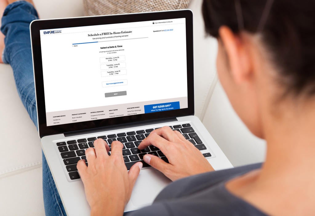 woman using laptop to get new floors