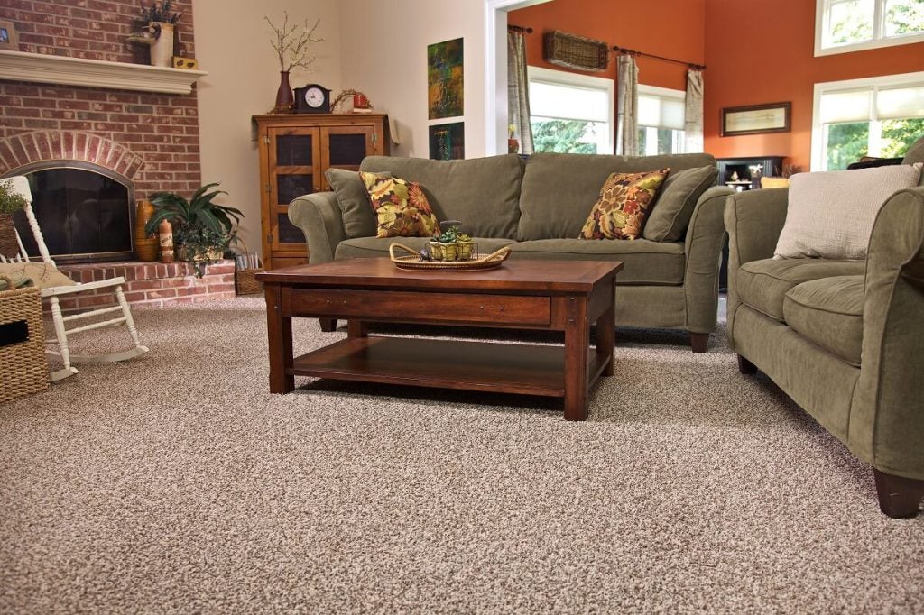 wall-to-wall carpet in a well-lit decorated living room