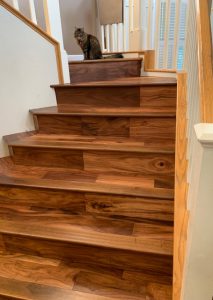 image of country bungalow hardwood flooring in saddleback color on stairs