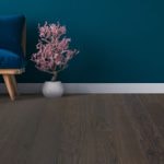 Featured Image: dark hardwood floors and dark green walls with white trim