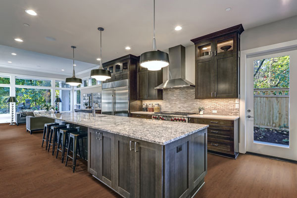 vinyl plank flooring in a kitchen with gray cabinetry