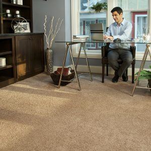 coffee spill being cleaned from 100% waterproof vinyl plank flooring