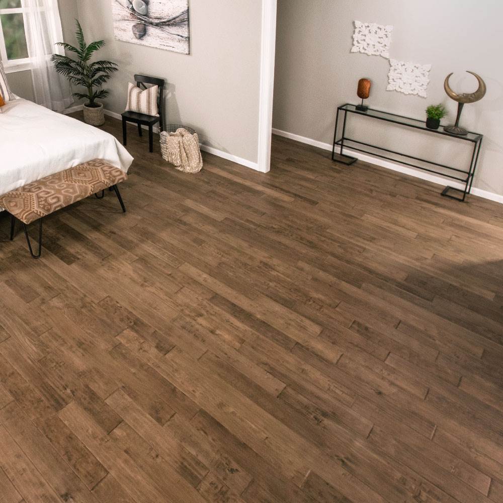 Laminate vs hardwood - view of hardwood flooring by Empire Today in bedroom