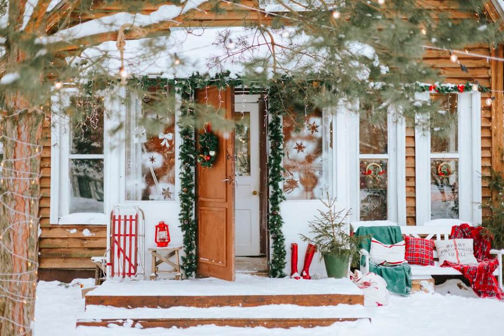 A beautiful country cottage with a snow-covered porch